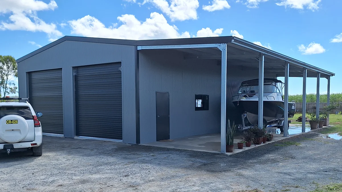 Photo of a clients large Colorbond garage with an awning housing his boat.