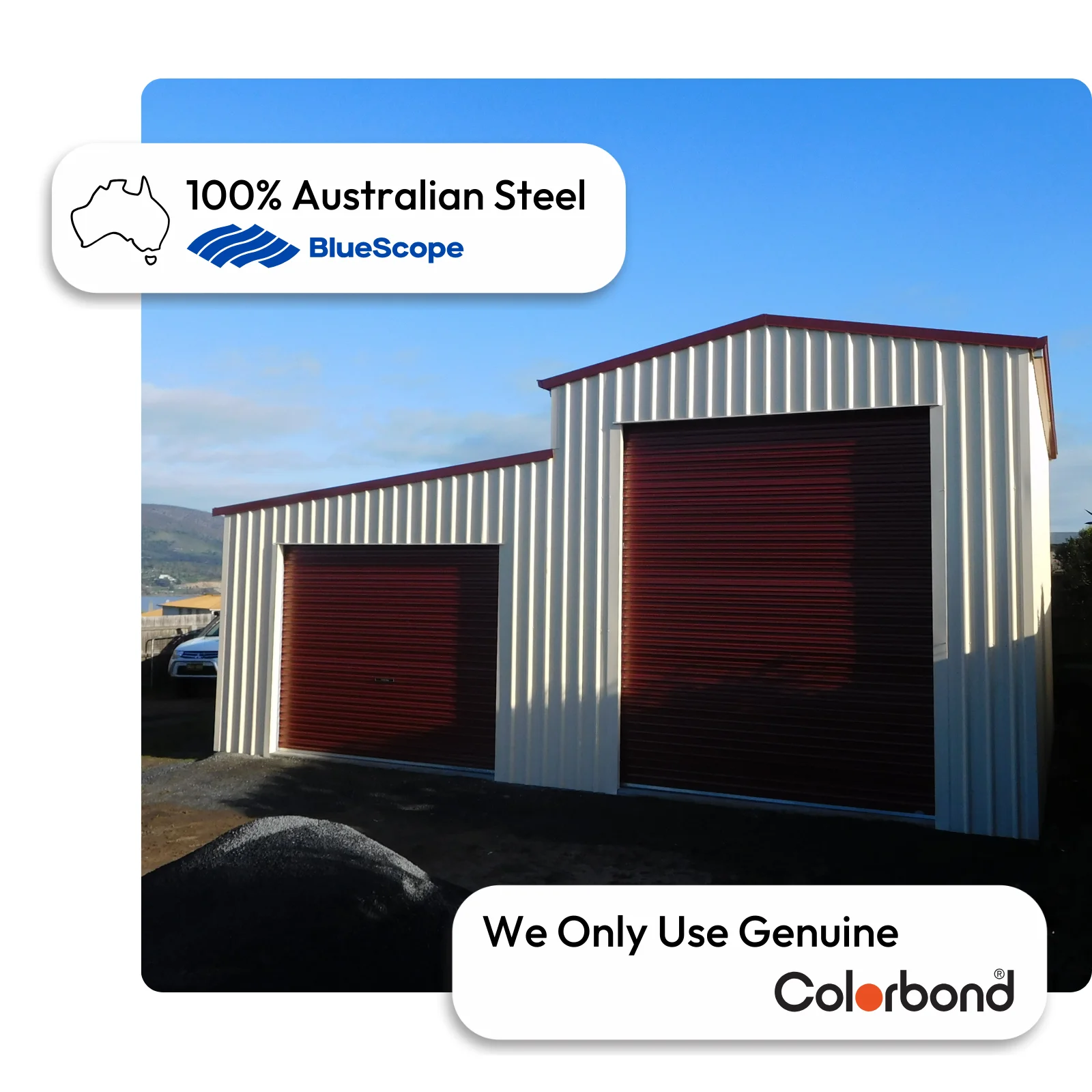 Australian-made barn shed with two roller doors and a gable roof featuring Manor Red® roof and Surfmist® walls