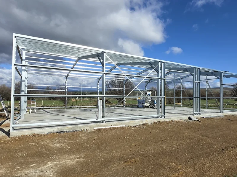 Australian-made machinery shed with side view of column and rafter frame construction.