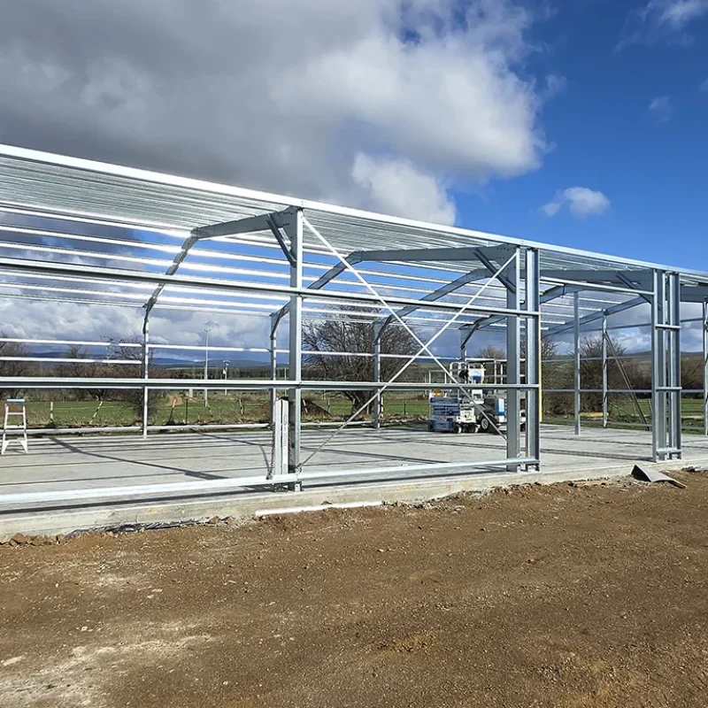 Australian-made machinery shed with side view of column and rafter frame construction.