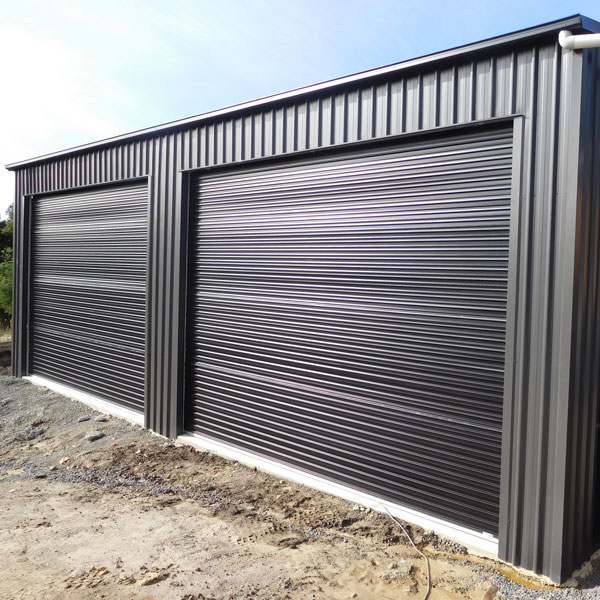 Shed with two large roller doors made in Gympie clad in Colorbond Monument