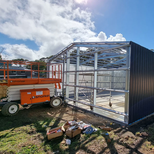 Shed under construction in Launceston with scissor lift
