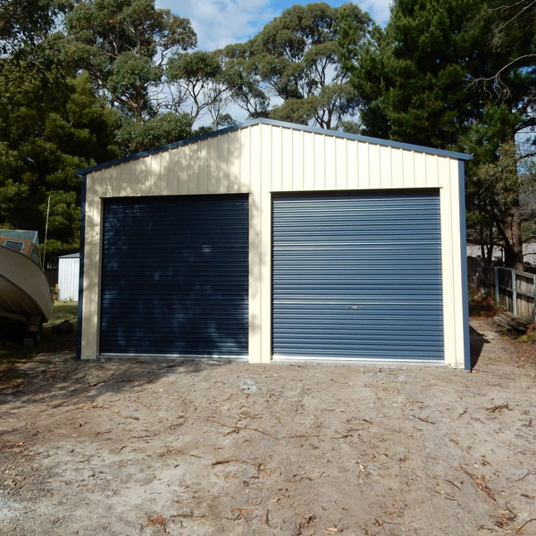 boat shed with classic cream walls and deep ocean roller doors