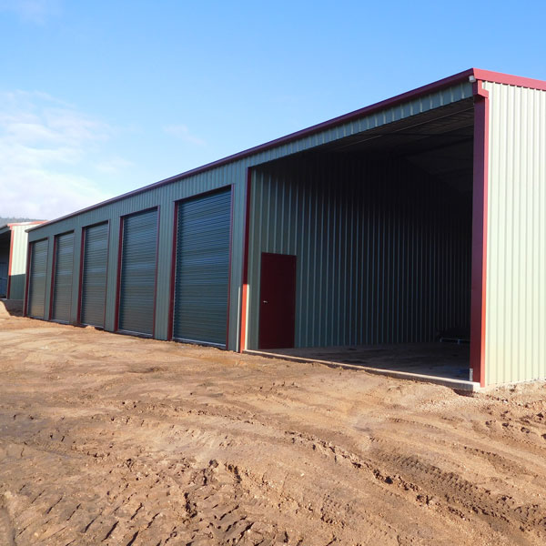 Large industrial shed built on a commerical site.