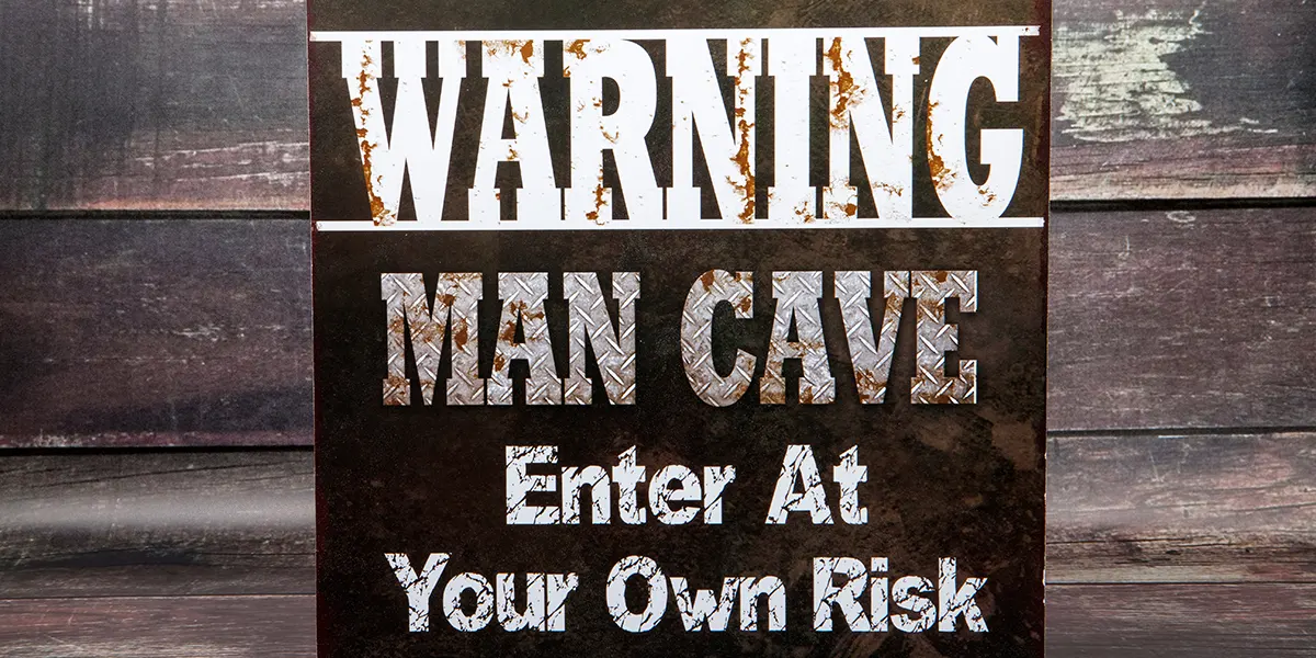 sign saying warning, man cave, enter at own risk